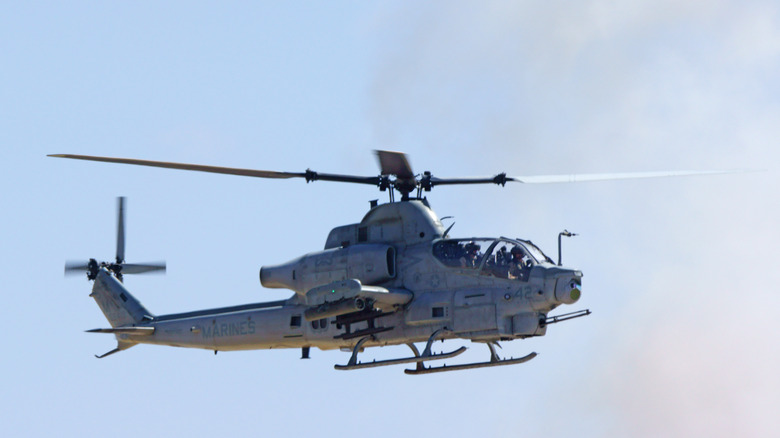 Bell AH-1 SuperCobra attack helicopter in flight.