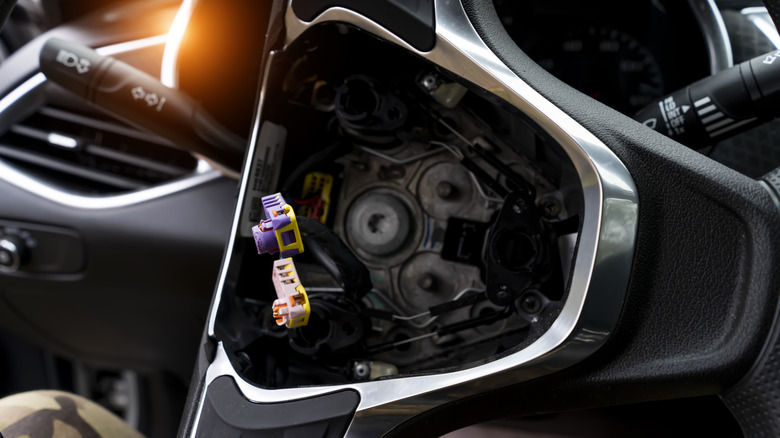 Airbag housing in a car's steering wheel