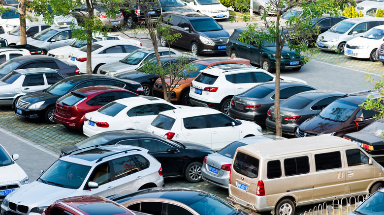 A high-angle view of a busy parking lot