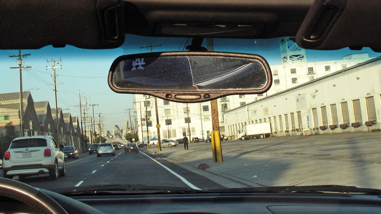 View through windshield of a busy road.