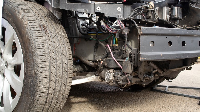 tesla with suspension components exposed