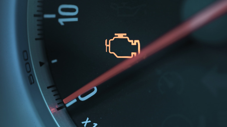 Close up of illuminated check engine light