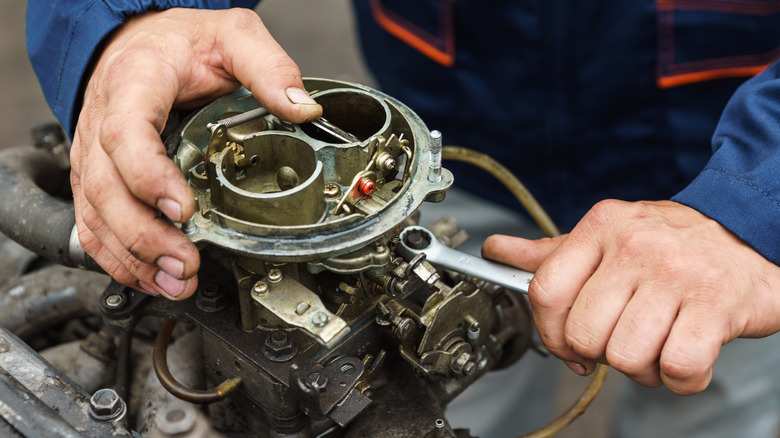 Mechanic working on a carburetor