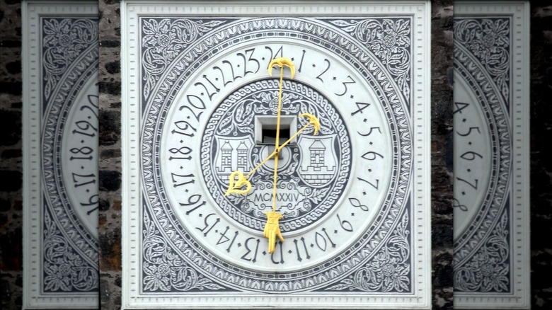 The 24-hour dial on the lower clock on the Nigra Turo or Černa věž (the Black Tower) located in Klatovy city in the Czech Republic;