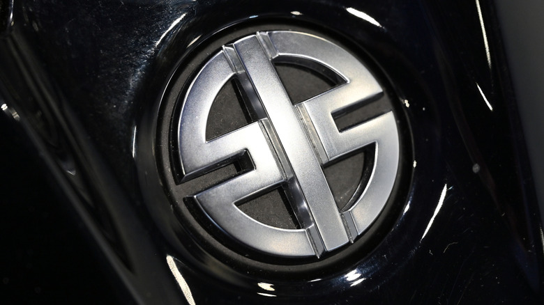 The Kawasaki River Mark logo on machinery.