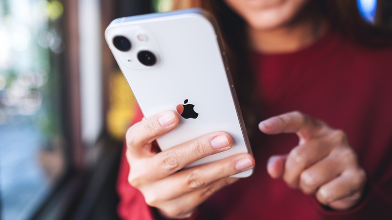Woman holding an iPhone