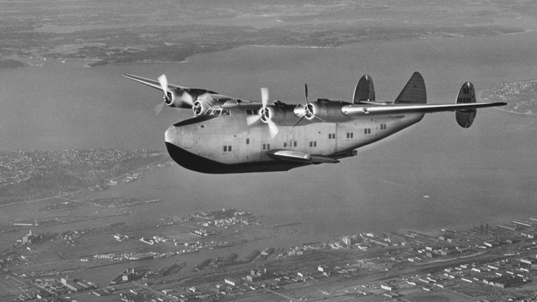 Black and white photo of Pan Am's Boeing 314 Clipper flying