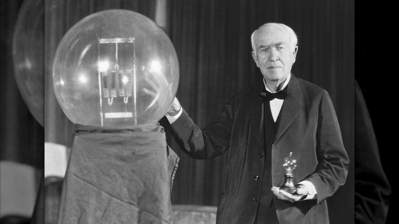 Thomas A. Edison exhibits a replica of his first successful incandescent lamp.