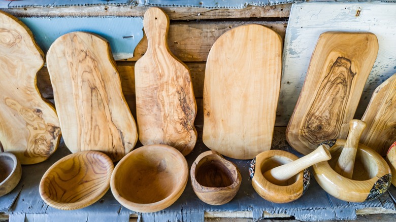 Ancient woodworking artifacts, cutting boards and mortars with pestles