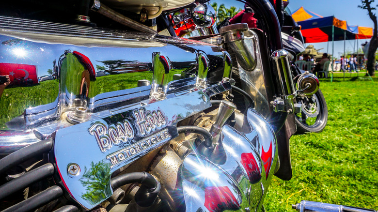 A close-up of a chrome Boss Hoss Motorcycle V8 engine on a sunny day