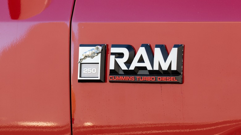 Closeup of logo emblem on Red Dodge Ram 250 Cummins Turbo Diesel 4x4 off-road American classic regular cab pickup truck.