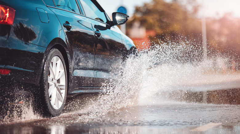 Car driving in rainy conditions