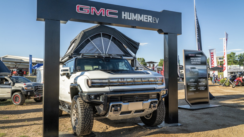 a white GMC Hummer EV at a car show