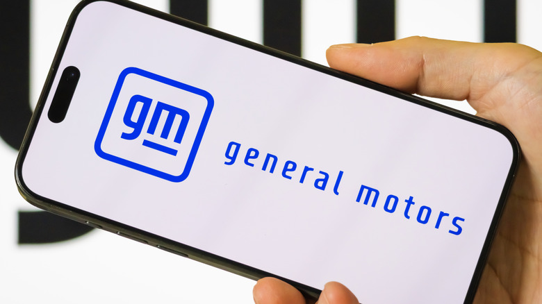 a smartphone displaying the General Motors Truck Company logo