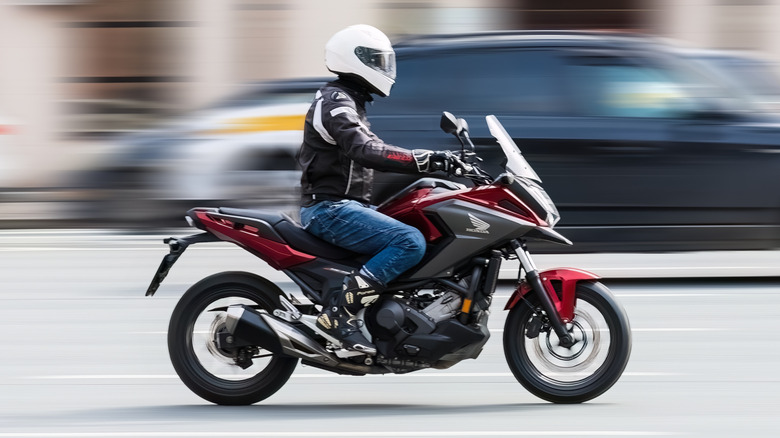 Person riding a Honda NC750X on a city road