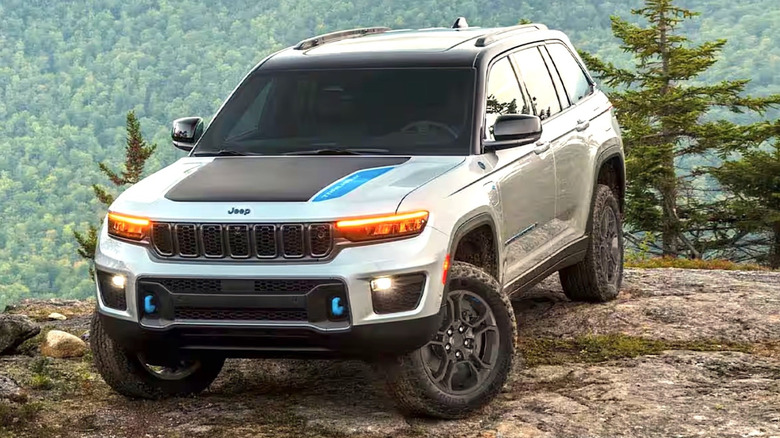A Jeep vehicle parked on top of a mountain.