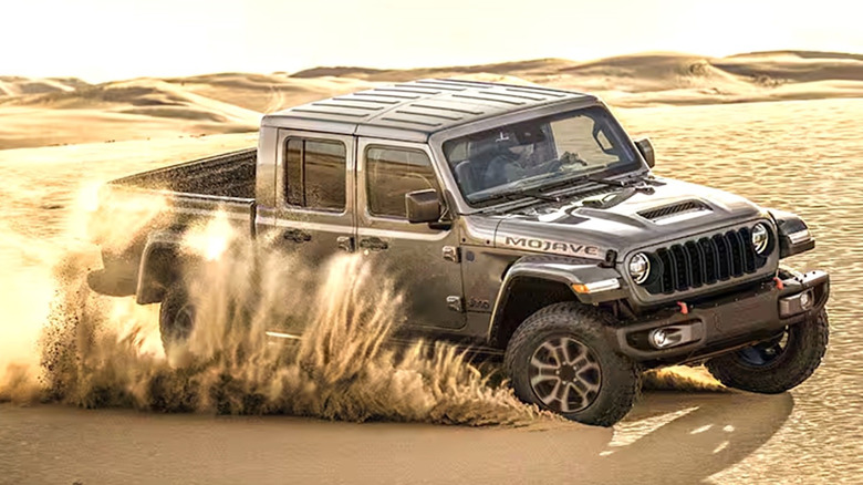 A Jeep vehicle driving through the desert.