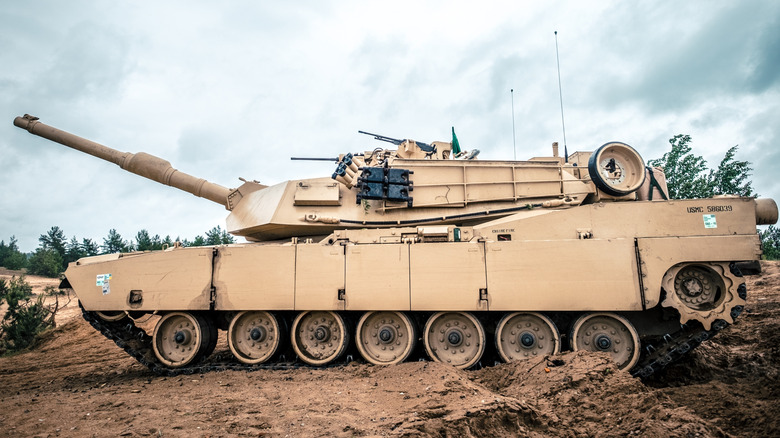 M1 Abrams tank parked on rough terrain