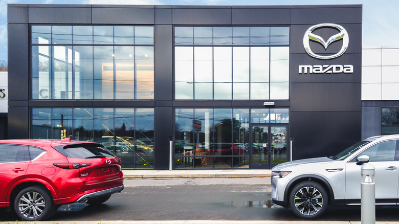 Mazda vehicles parked near dealership