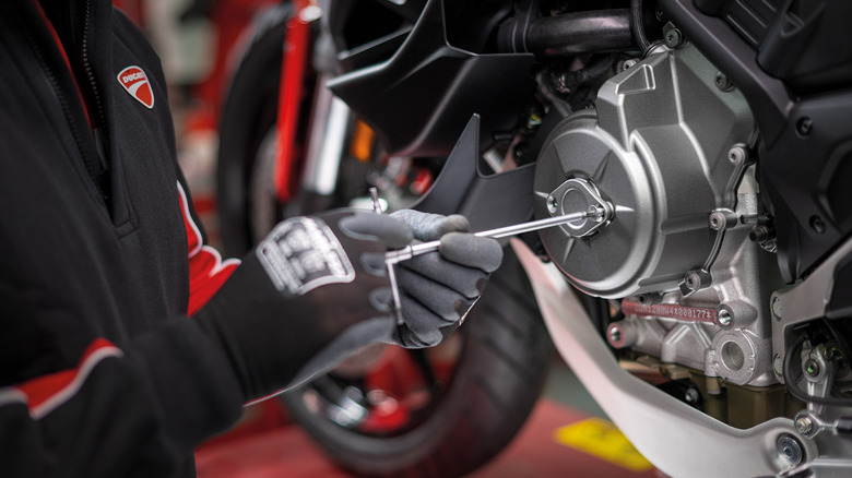 Mechanic working on a Ducati engine