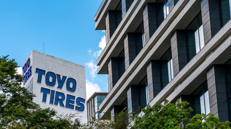A Toyo Tires sign next to the company office building in Japan