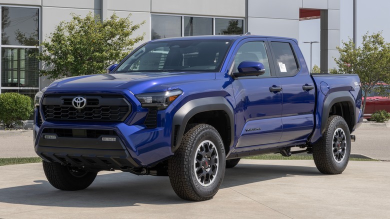 A blue Toyota Tacoma TRD Offroad Pickup parked