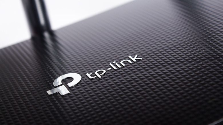 Close-up of TP-Link logo on top of a router