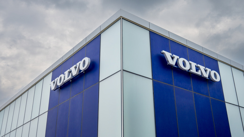 A Volvo dealership building with the company's logo prominently displayed