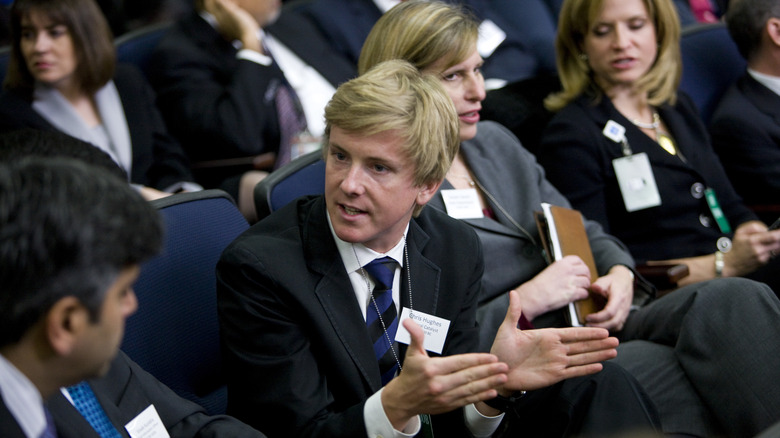 Chris Hughes having a discussion