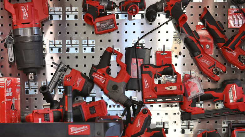 Milwaukee tools on metal rack