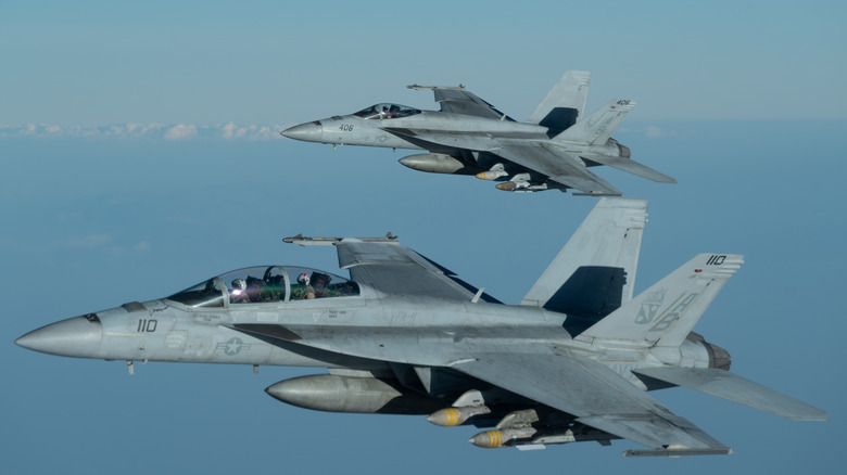 Two Super Hornet jets in flight.