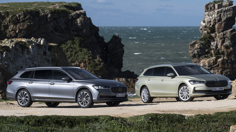 Two Skoda Octavias parked beside rugged seashore