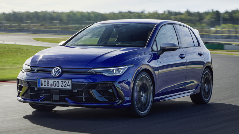 A blue Volkwswagen Golf R on a race track