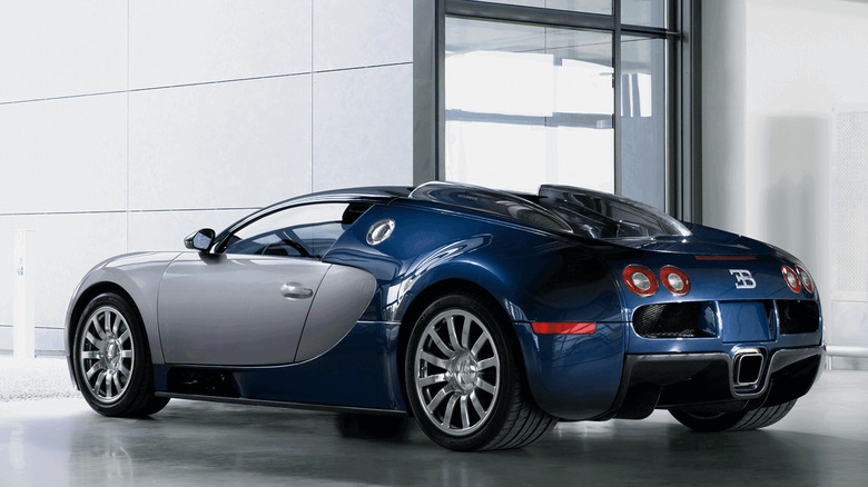 A Bugatti Veyron 16.4 with 365mm rear tires, rear-left view inside a white building