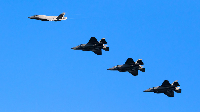 A formation of F-35 Lightning II aircraft in flight