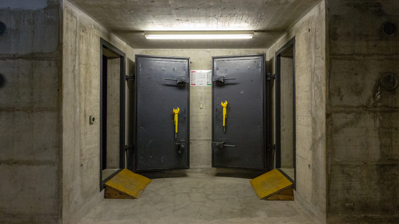 Two open bunker doors in a building basement in Switzerland