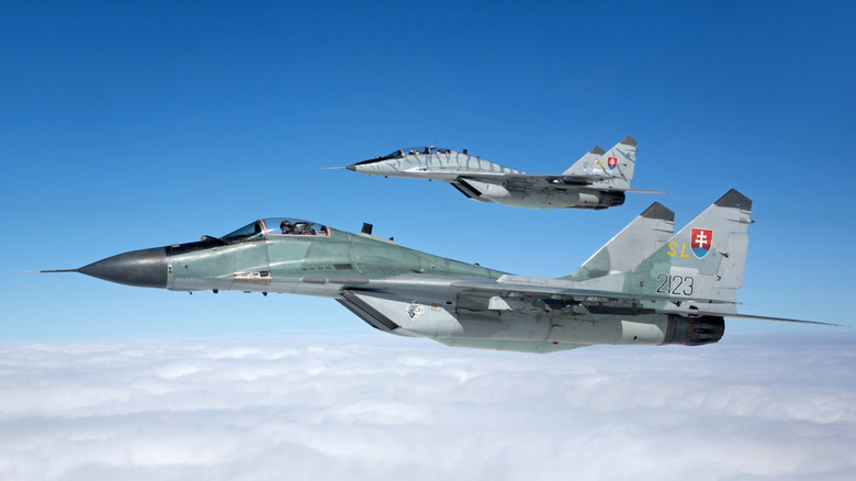 Two MiG-29 fighter jets flying in formation