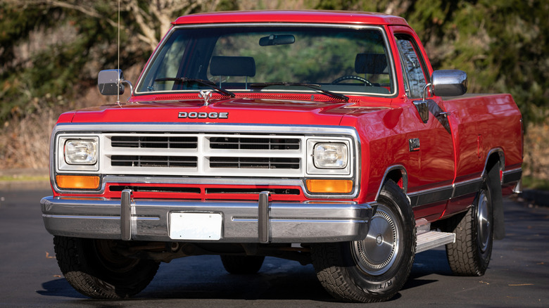 Front 3/4 view of red Dodge pickup truck with Cummins diesel engine