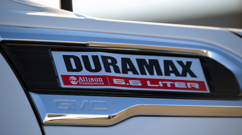 A Duramax badge on a white GMC vehicle