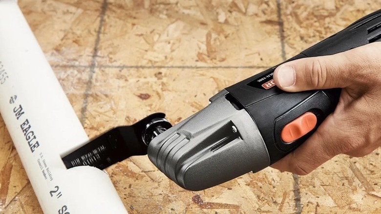 Person using Warrior oscillating tools from Harbor Freight