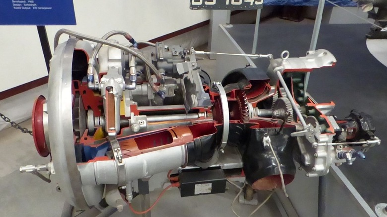 A close-up of an opened Boeing T50 engine on display at a museum