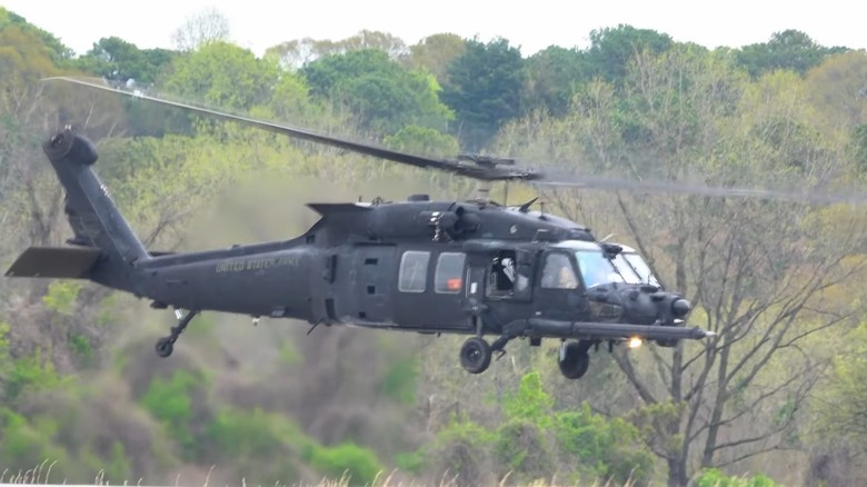A SOCOM MH-60 Black Hawk helicopter hovering