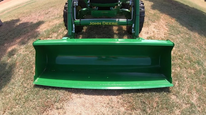 Close-up front view of the John Deere 4052M tractor.