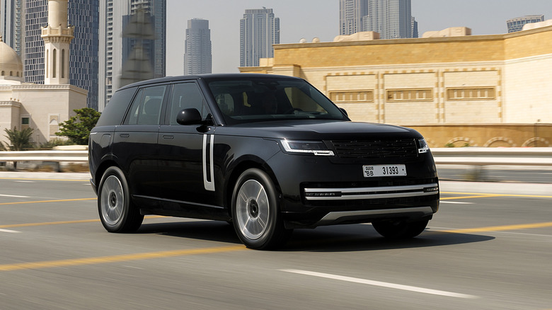 Black 2025 Range Rover on the road in a city