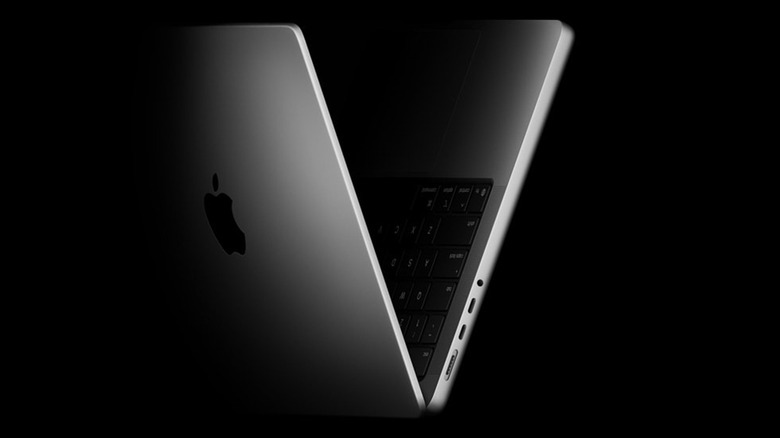 Folded MacBook Pro M5 on a black background
