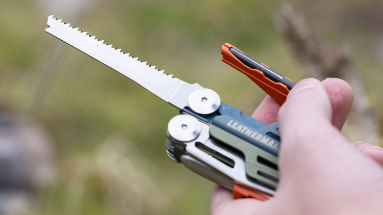 a Leatherman Signal with the saw and sharpener tools visible.