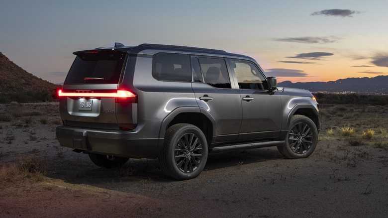 Lexus GX rear angle view parked in desert at twilight