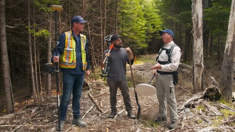 Steve Guptil, Gary Drayton, and Jack Begley look for the "hole under the hatch" on Oak Island.