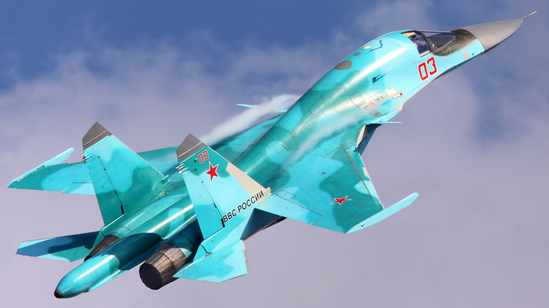 Russian Air Force Sukhoi-Su 34 climbing at high speed in blue skies