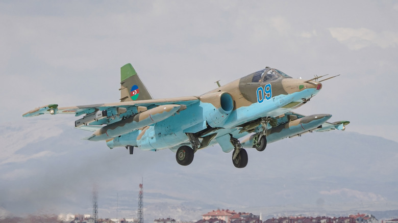 Fully armed Azerbaijan Air Force Sukhoi-Su-25 Frogfoot flying with extended landing gear